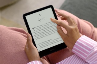 Amazon Kindle Paperwhite 2024 e-reader displaying crisp text on its 6.8-inch E Ink screen, with thin bezels and waterproof design