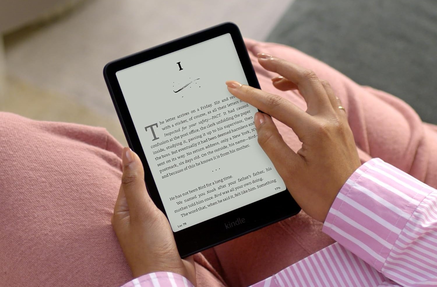 Amazon Kindle Paperwhite 2024 e-reader displaying crisp text on its 6.8-inch E Ink screen, with thin bezels and waterproof design