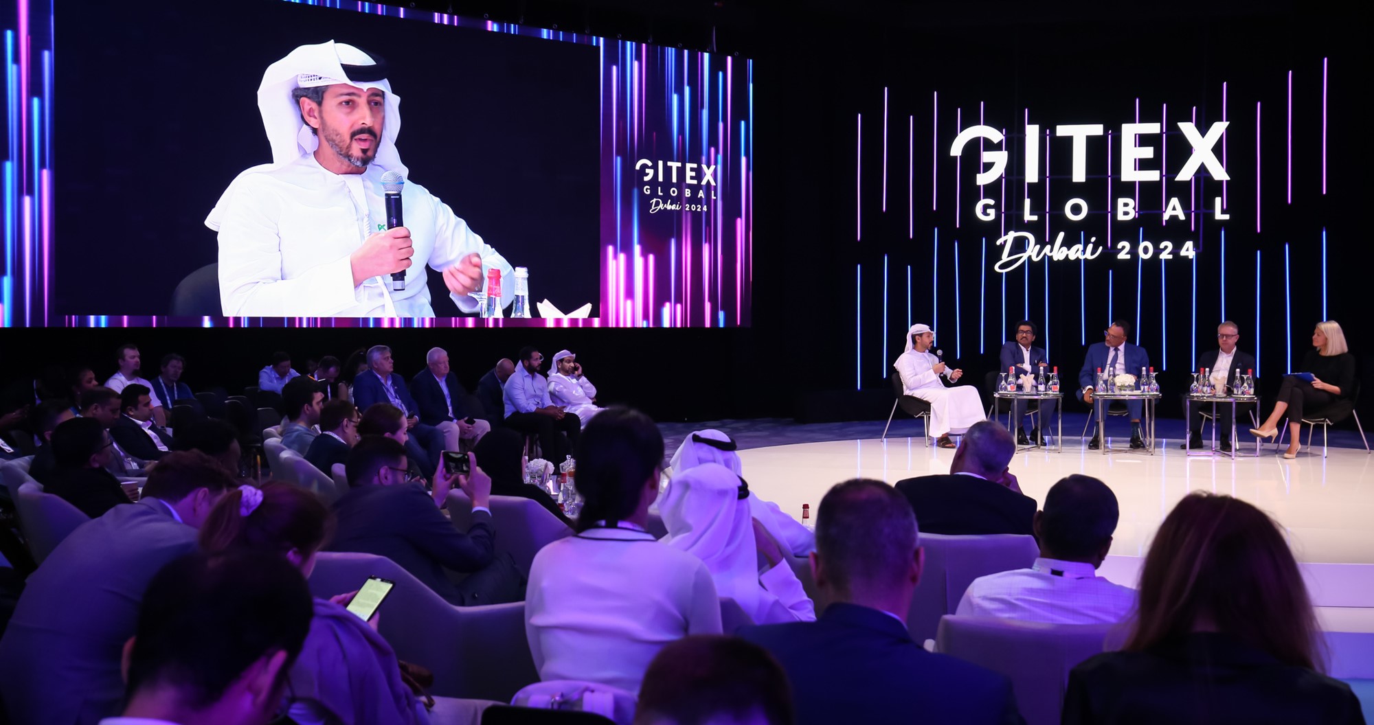 Panel discussion at GITEX GLOBAL 2024 featuring industry leaders discussing future trends and investment opportunities in data centres