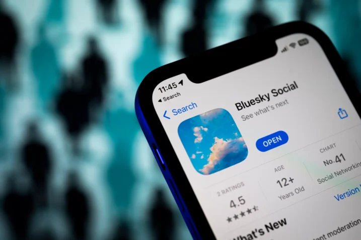 Bluesky social media app interface displaying user profiles and options for posting, sharing, and following