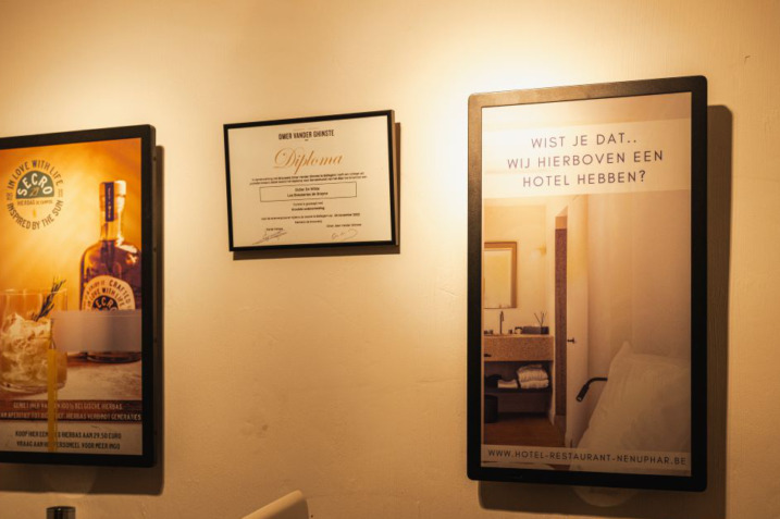 Elegant interior of Nenuphar restaurant featuring slim Philips digital signage.