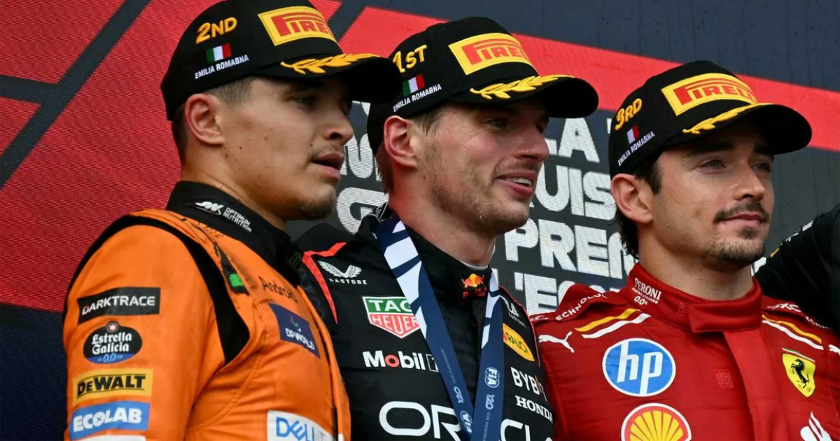 Lando Norris on the podium with Max Verstapppen and Charles Leclerc.