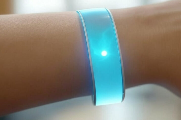 Illustration of a flexible piezoelectric energy harvester integrated into a wearable device, showcasing its potential to convert body movements into electricity.