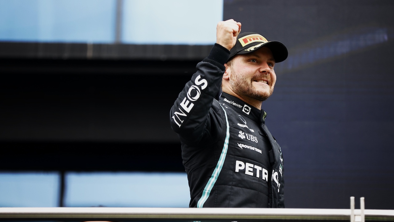 Valtteri Bottas back in a Mercedes F1 suit, celebrating his return to the team as a reserve driver for the 2025 season.