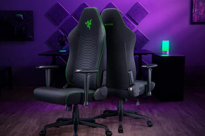 Razer's CES 2025 booth displaying the new black Iskur V2 X gaming chair next to the experimental Project Arielle with integrated cooling system