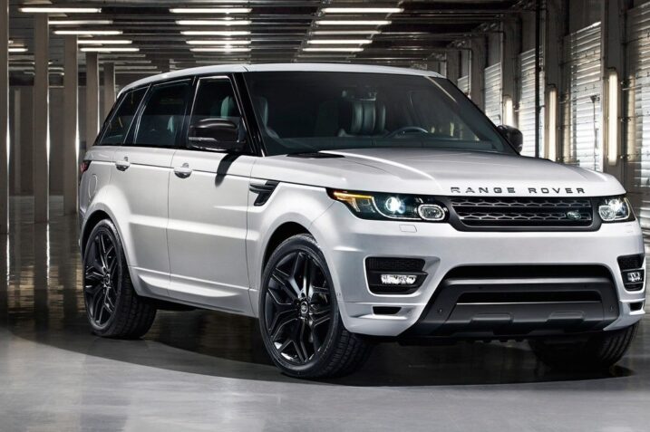 Jaguar Land Rover logo with warning icons and cybersecurity threat symbols in background.
