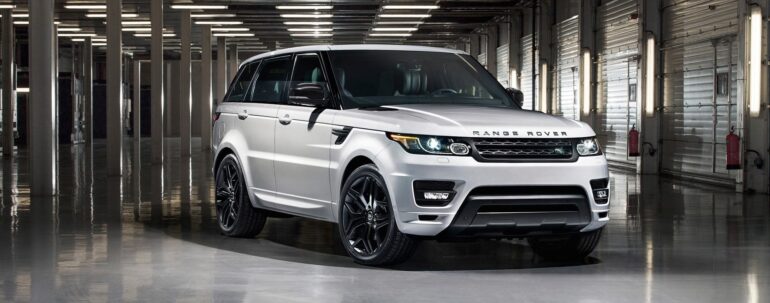 Jaguar Land Rover logo with warning icons and cybersecurity threat symbols in background.